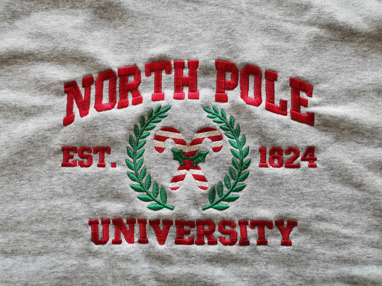 North Pole University Embroidered Christmas Sweatshirt Holiday Crew Neck Hoodie image 1